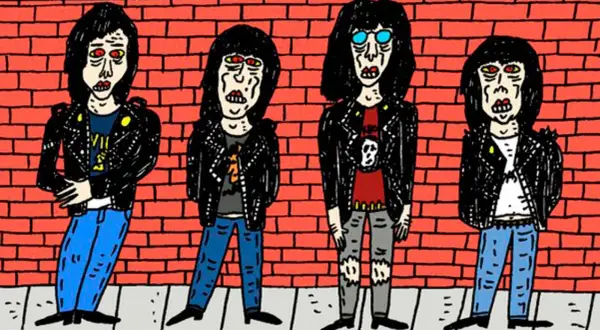 Cuatro figuras con chaquetas de cuero y pelo negro, un ícono del origen del punk, posan frente a un muro de ladrillos rojos.