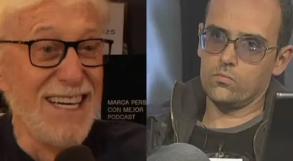 Dos hombres, uno sonriente con barba blanca y gafas, el otro con gafas de sol y expresión seria. Se busca productor musical para este proyecto.