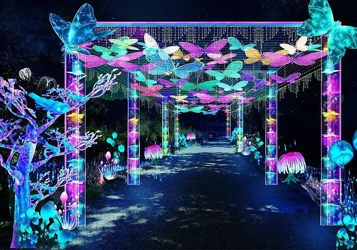 Un camino iluminado con mariposas de ne&oacute;n y setas brillantes, como en un festival de Sophie.