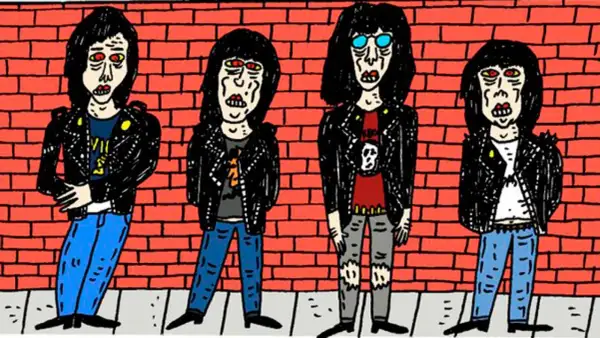 Cuatro figuras con chaquetas de cuero y pelo negro, un ícono del origen del punk, posan frente a un muro de ladrillos rojos.