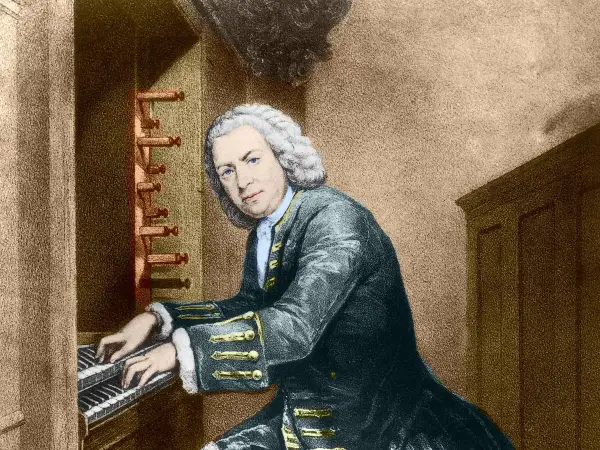 Johann Sebastian Bach, tocando el órgano, quizás componiendo su obra más famosa de Bach.