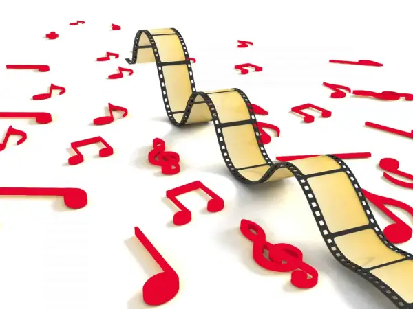 Una película se entrelaza con notas musicales rojas, ilustrando cómo es la música incidental, que acompaña y realza la narrativa visual.